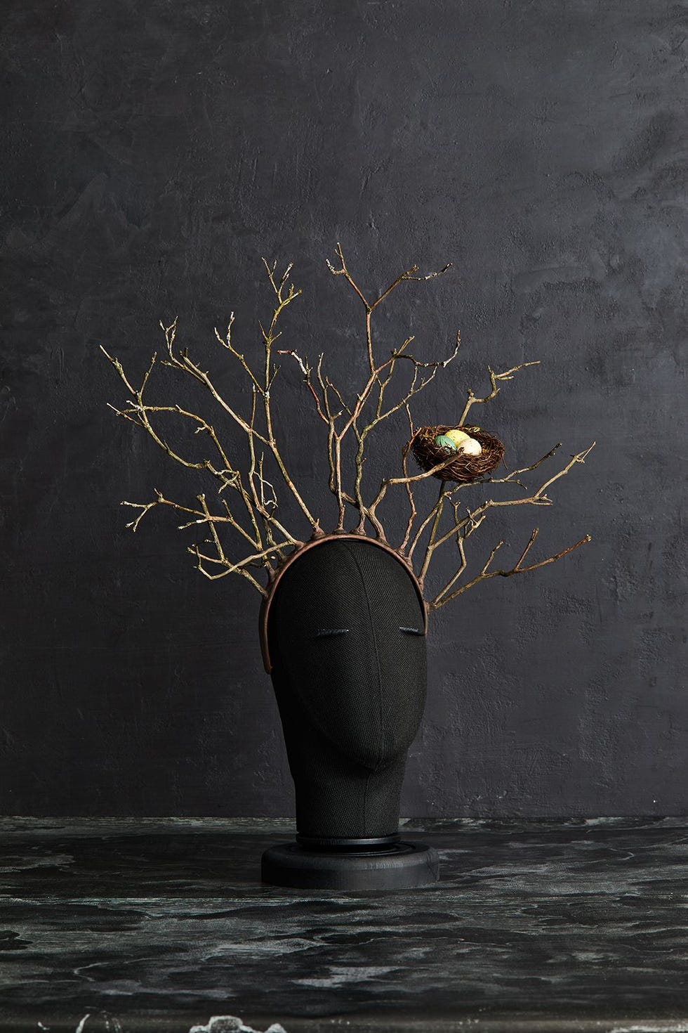 easy halloween costume, diy tree headband on a black doll head against a black background