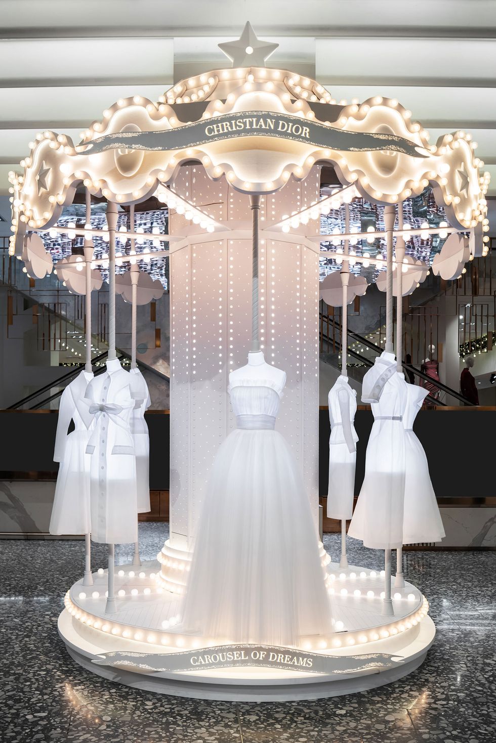 a carousel featuring silhouettes from dior at saks fifth avenue