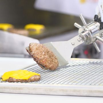 flippy, a robot, turns over a hamburger patty