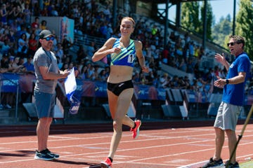 jane hedengren breaks the finish line tape at the brooks pr invitational