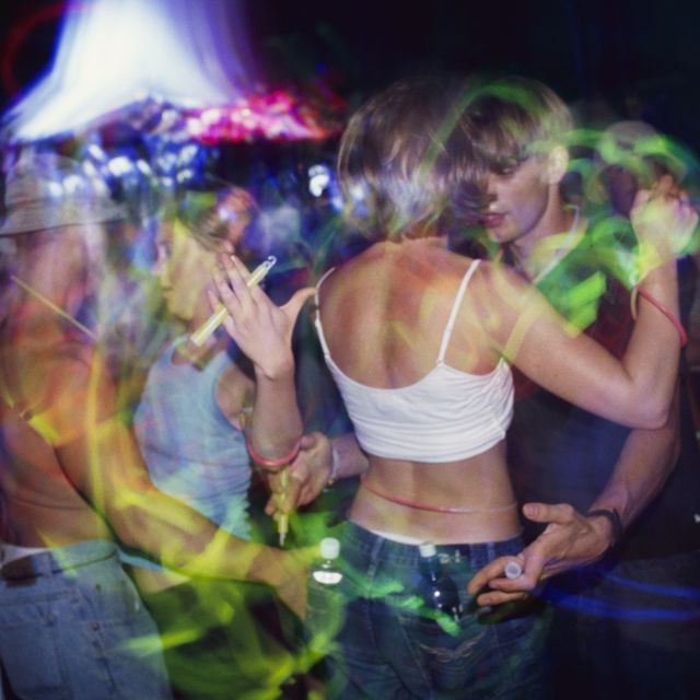 young people at woodstock dance with glow sticks after dark at woodstock '99 photo by henry diltzcorbis via getty images