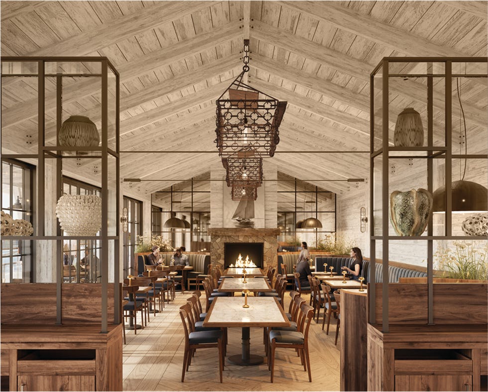 interior of a modern restaurant featuring a fireplace seating arrangements and decorative elements