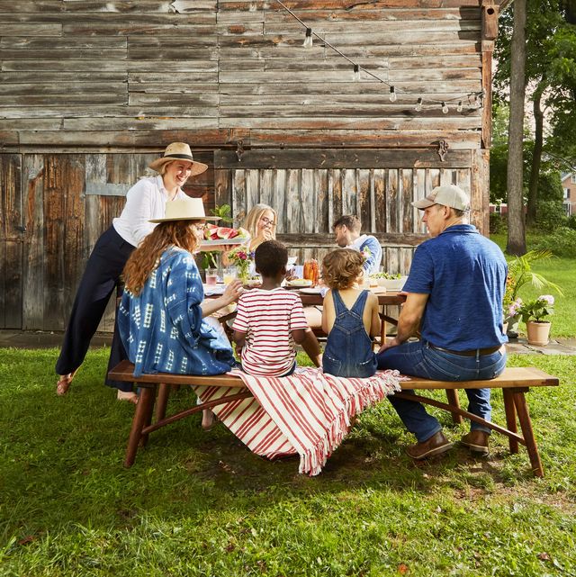 family eating picnic outdoors