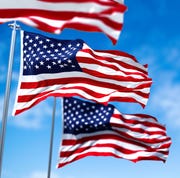 labor day quotes - waving flags lead image clear sky in the background selective focus democracy, independence and election day patriotic symbol of american pride
