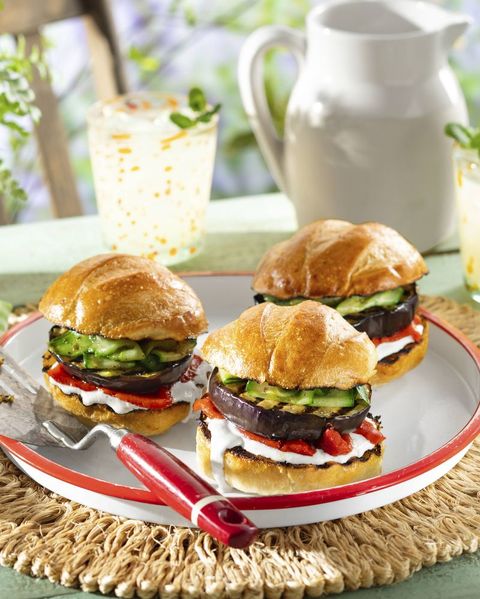 eggplant burgers arranged on a white tray with red trim
