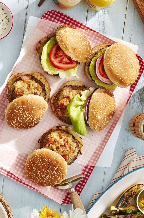 worcestershire glazed burgers arranged on a parchment lined red gingham tray