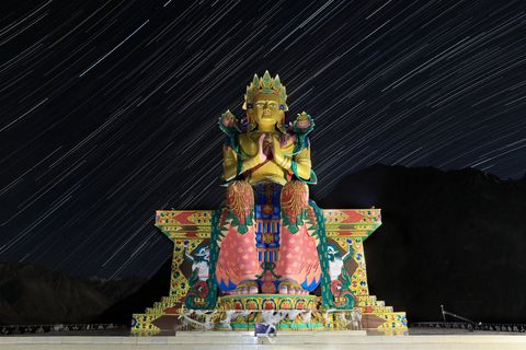 This starstreaked 106foothigh statue of Jampa Buddha sits atop Diskit monastery the oldest and largest Buddhist monastery in Ladakhs Nubra Valley Overlooking the Shyok River the remote valley is one of the top spots in India for stargazing and is best visited during summer snowy winters often make the area inaccessible