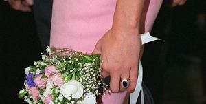 argentina   november 24  princess diana holding a bouquet of flowers and her christian dior handbag during her official visit to argentina  photo by tim graham photo library via getty images