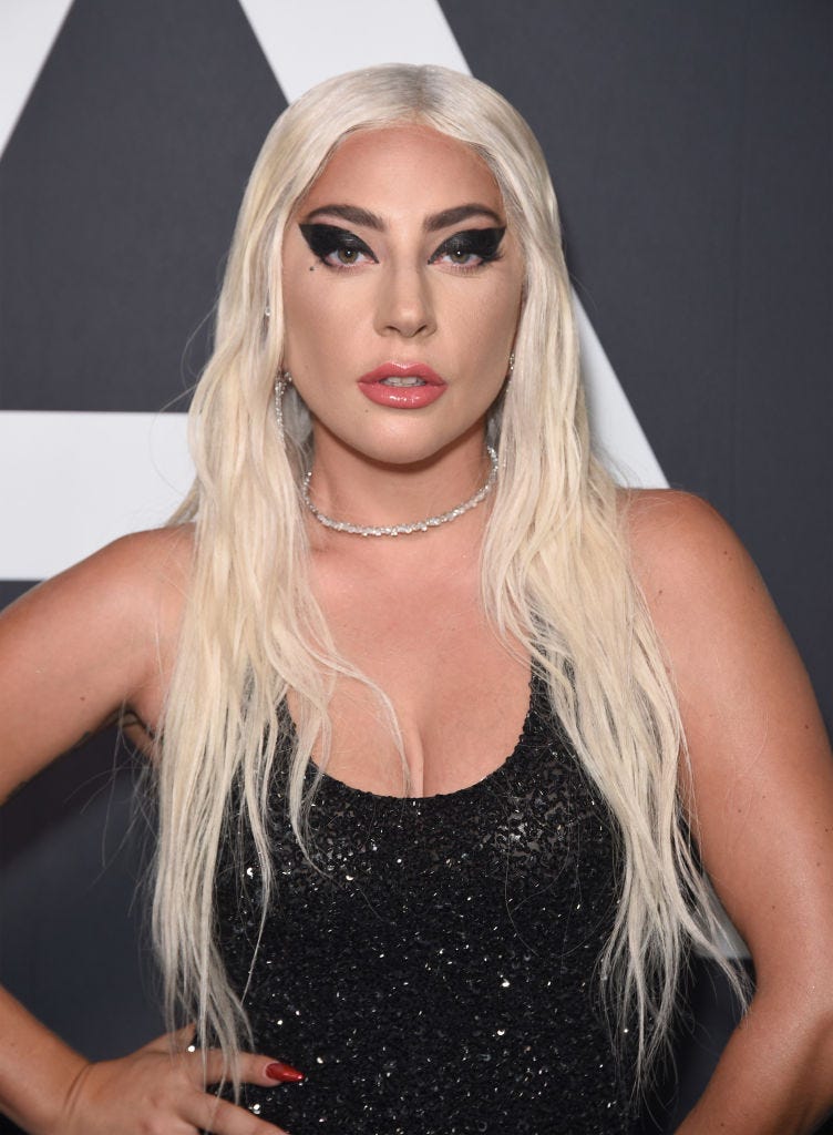 Lady Gaga wears a sparkly black tank dress and black eyeliner on the red carpet