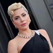 lady gaga attends the 64th annual grammy awards in black dress and diamond jewelry
