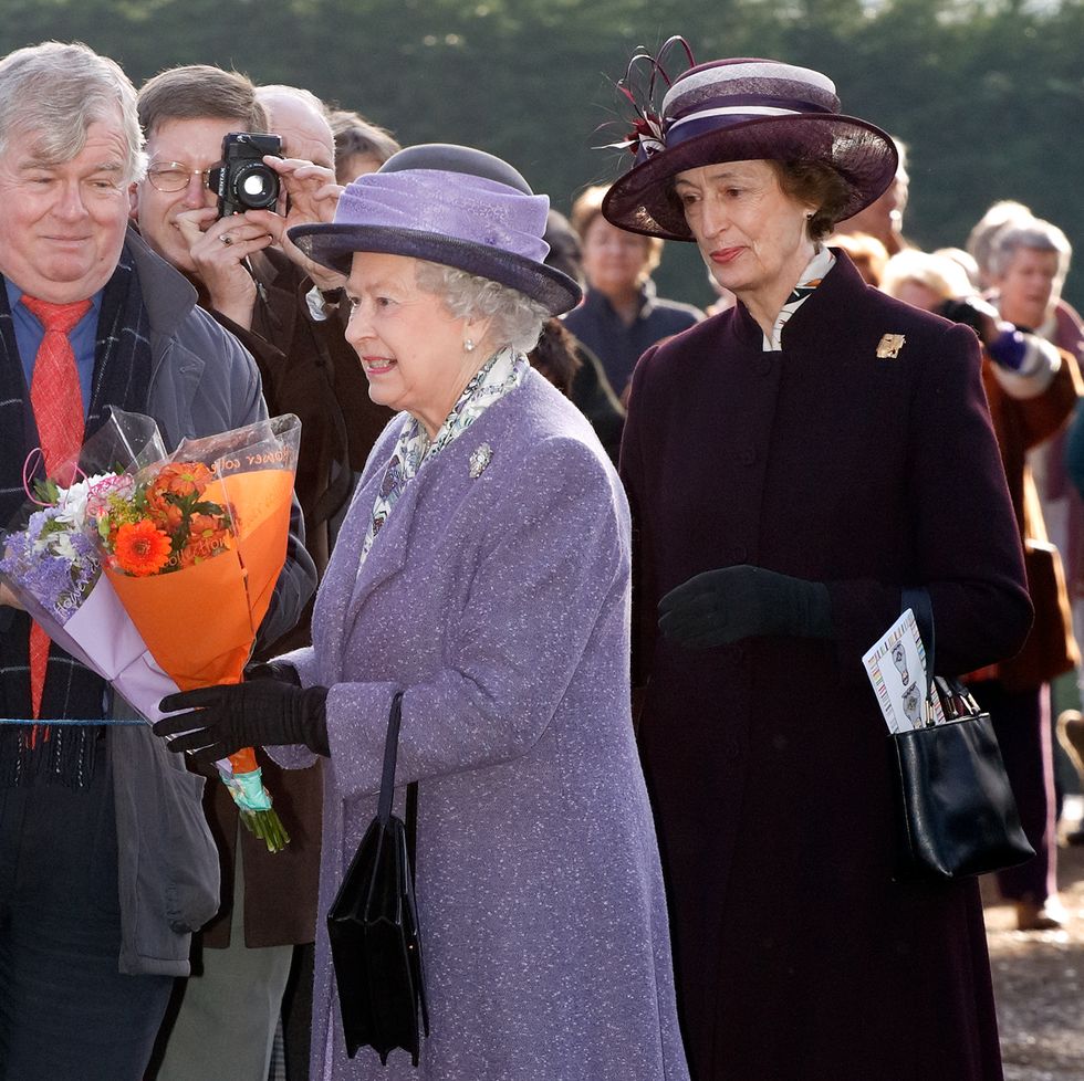 queen elizabeth ii, accompanied by her lady in waiting lady susan hussey, meets members of the public during a walkabout