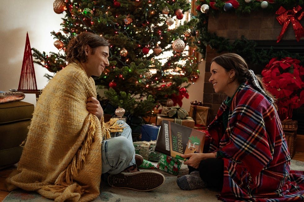 dustin milligan as jack snowman and lacey chabert as kathy barrett in hot frosty