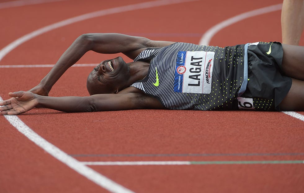 Lagat lying on the track