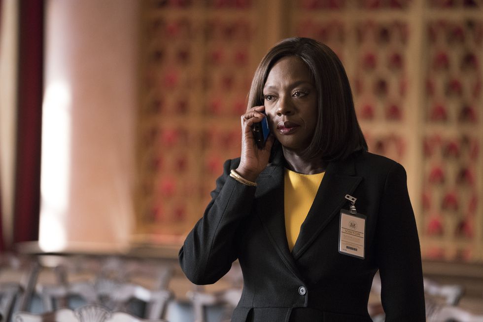 viola davis speaking into a phone in a courtroom during a scene from the tv series how to get away with murder