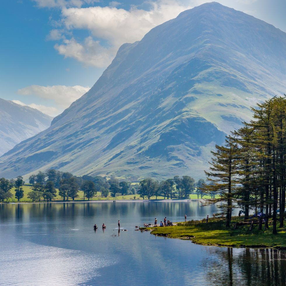 beautiful lake of buttermere surrounded by green hill in englands lake district