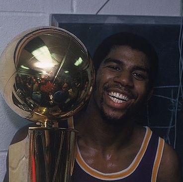 philadelphia, pa   may 16  magic johnson 32 of the los angeles lakers celebrates with the walter a brown championship trophy after winning game 6 and series against the philadelphia 76ers on may 16, 1980 at the spectrum in philadelphia, pennsylvania  photo by focus on sport via getty images