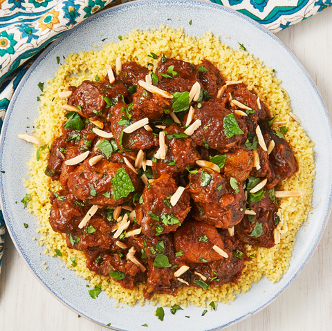 lamb tagine topped with slivered almonds atop couscous