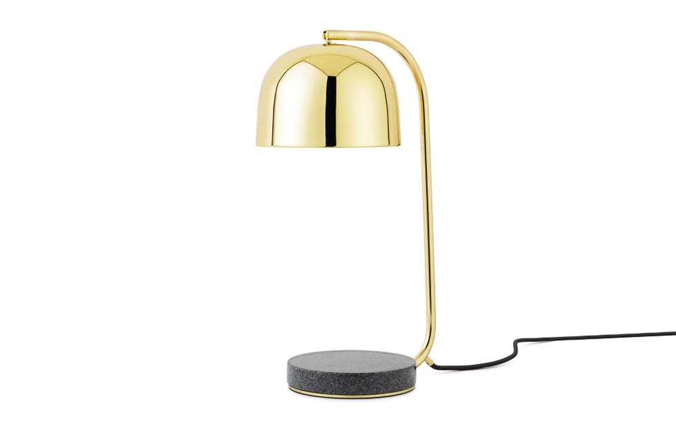 lámpara de mesa en metal dorado con brillo