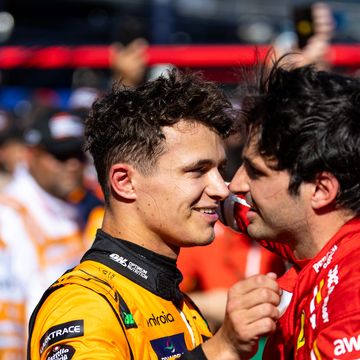 lando norris and carlos sainz hug each other after a formula 1 race