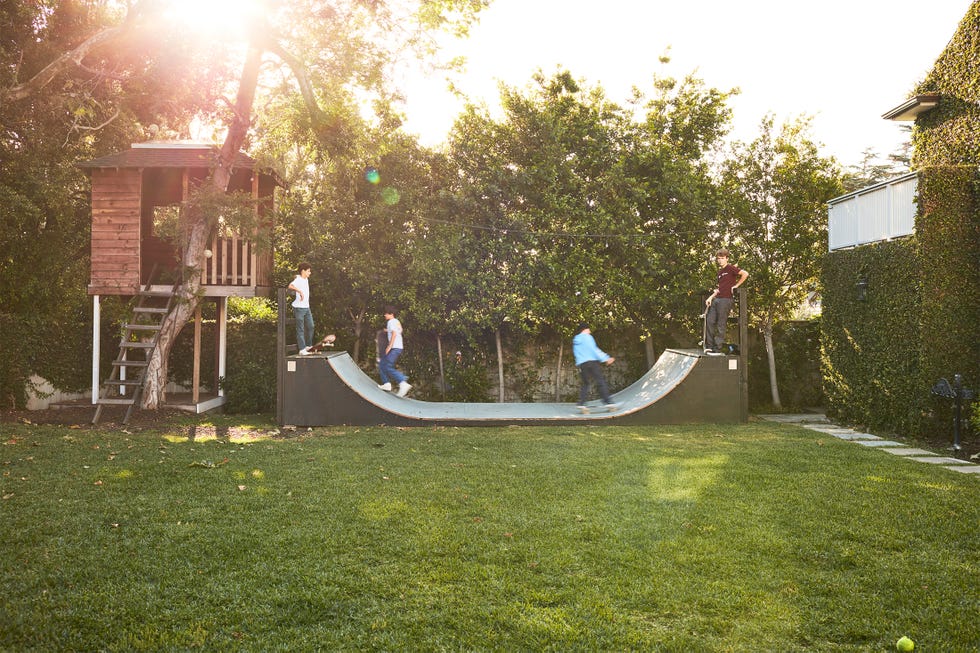 treehouse and skateboarding in yard