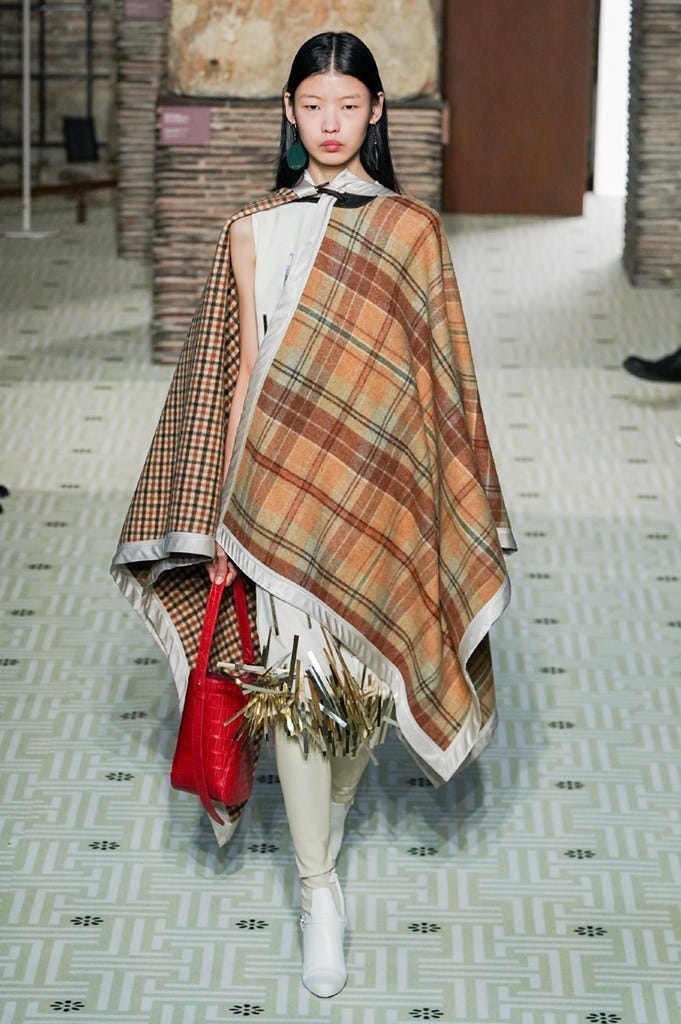 Clothing, Tartan, Fashion, Poncho, Outerwear, Pattern, Stole, Fashion model, Plaid, Textile, 