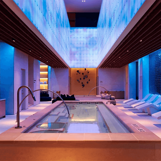 spa interior with a pool and relaxation area spa interior with a pool and relaxation area