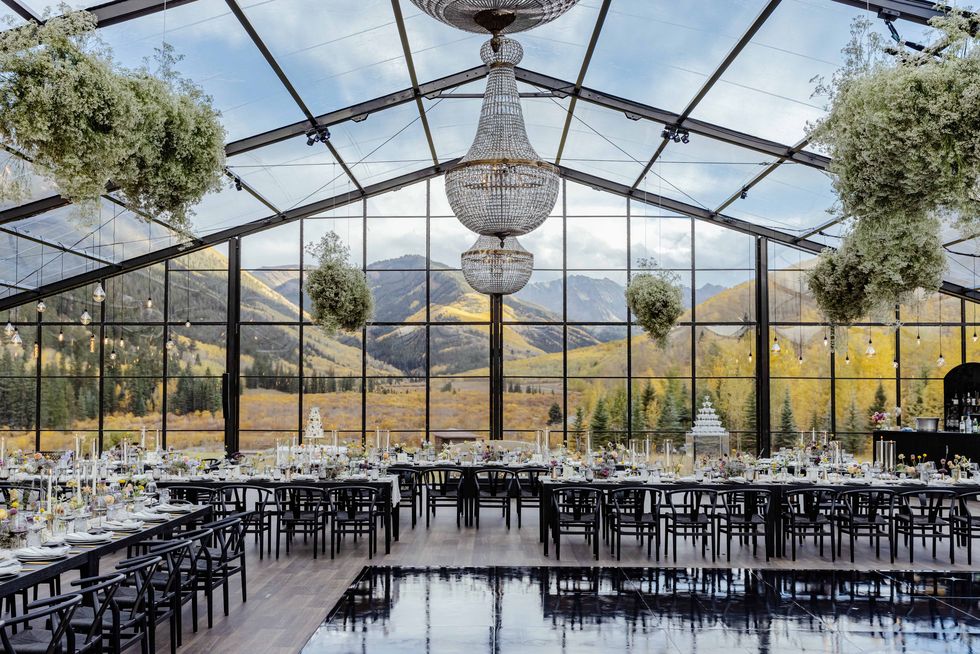 a wedding tent looking out onto mountains