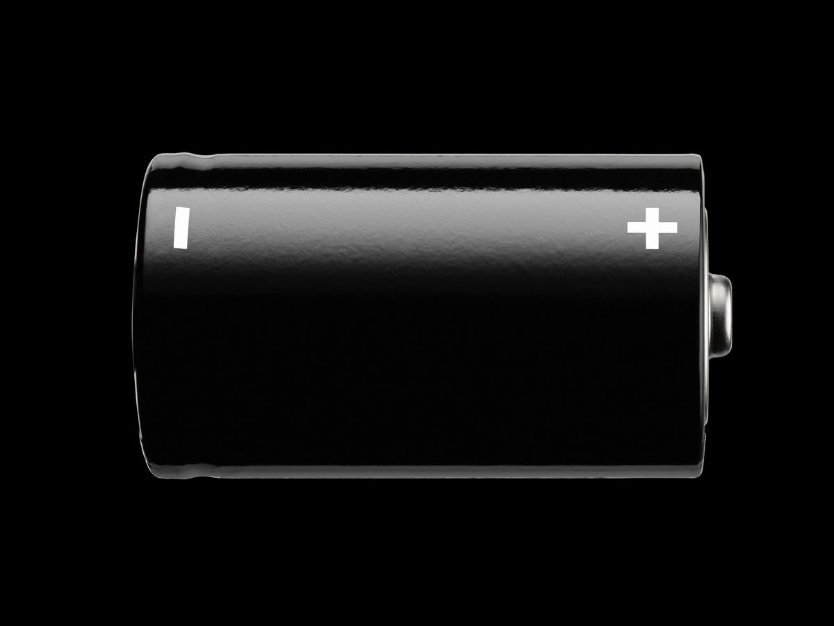large black battery, on black background