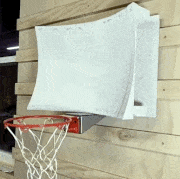a basketball going into a hoop with a curved backboard in slow motion