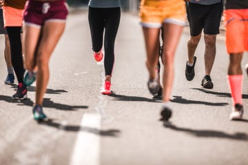 large group of unrecognizable marathon runners having a race on the road