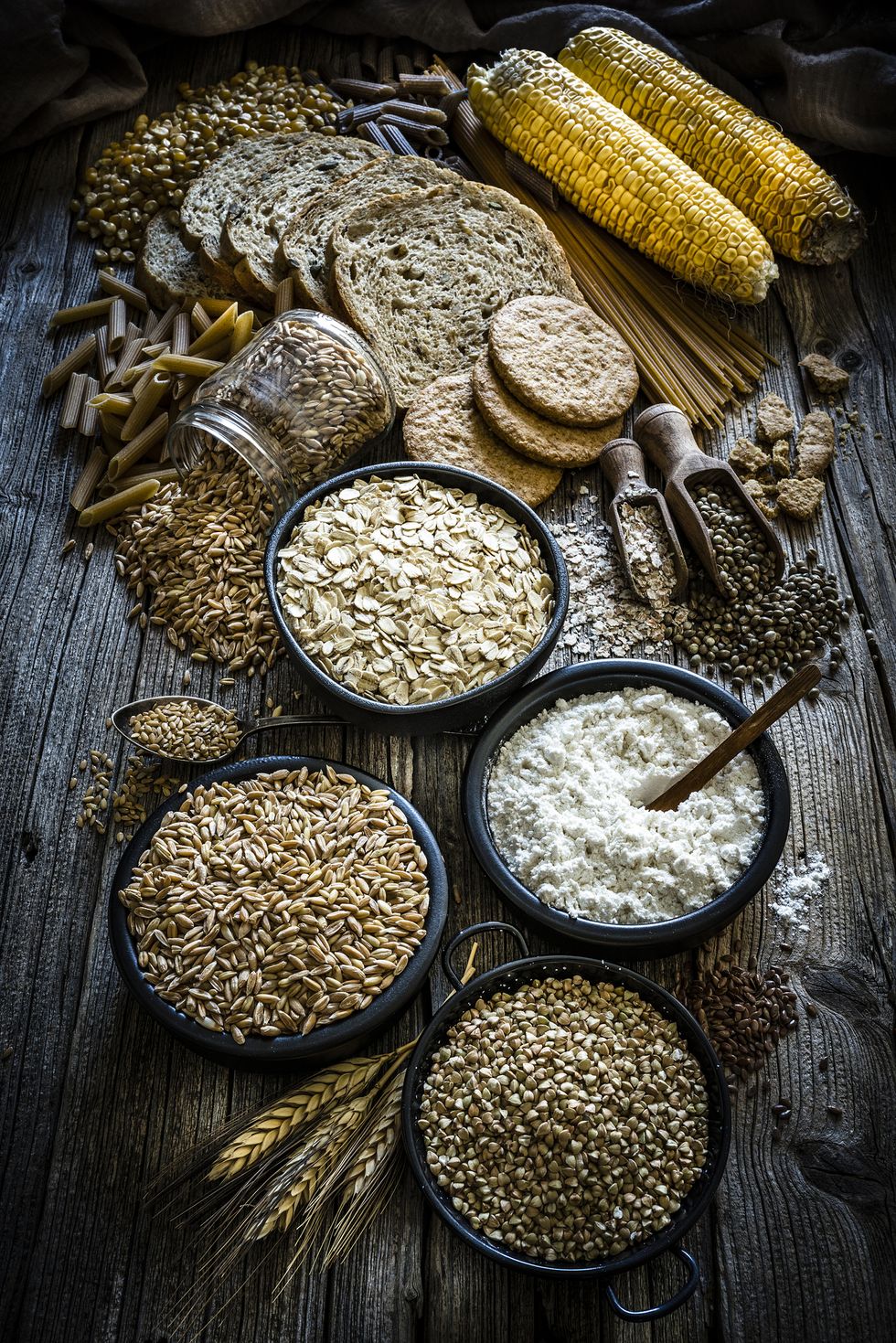 large group of wholegrain food shot on rustic wooden table