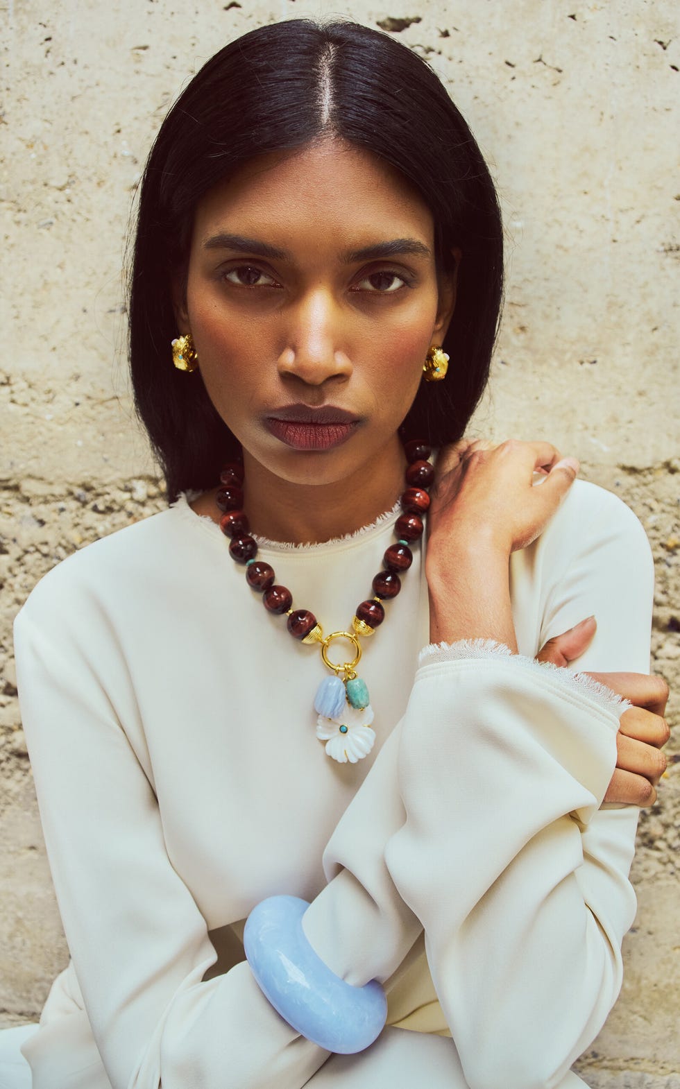 woman wearing colorful stone jewelry