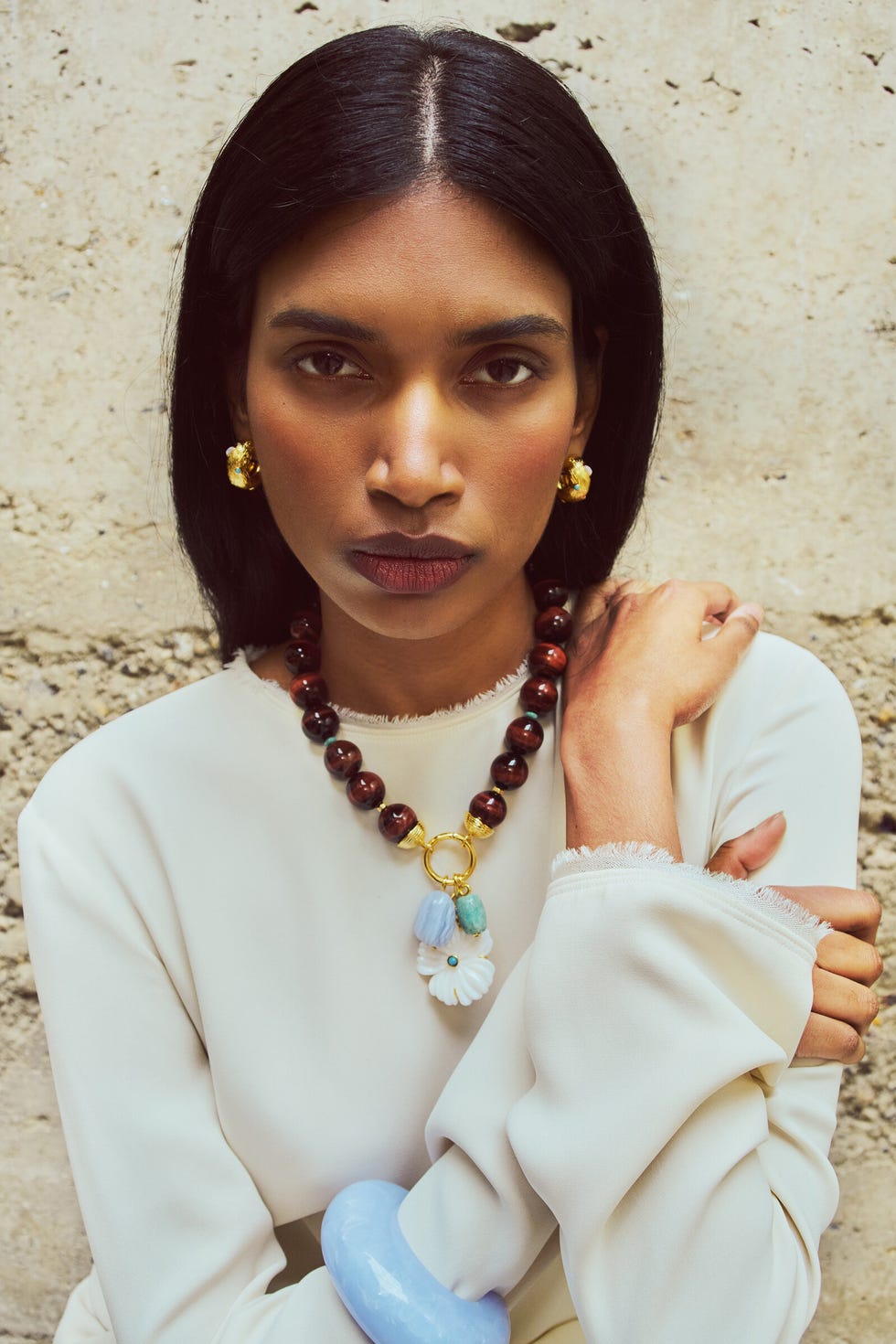 woman wearing colorful stone jewelry
