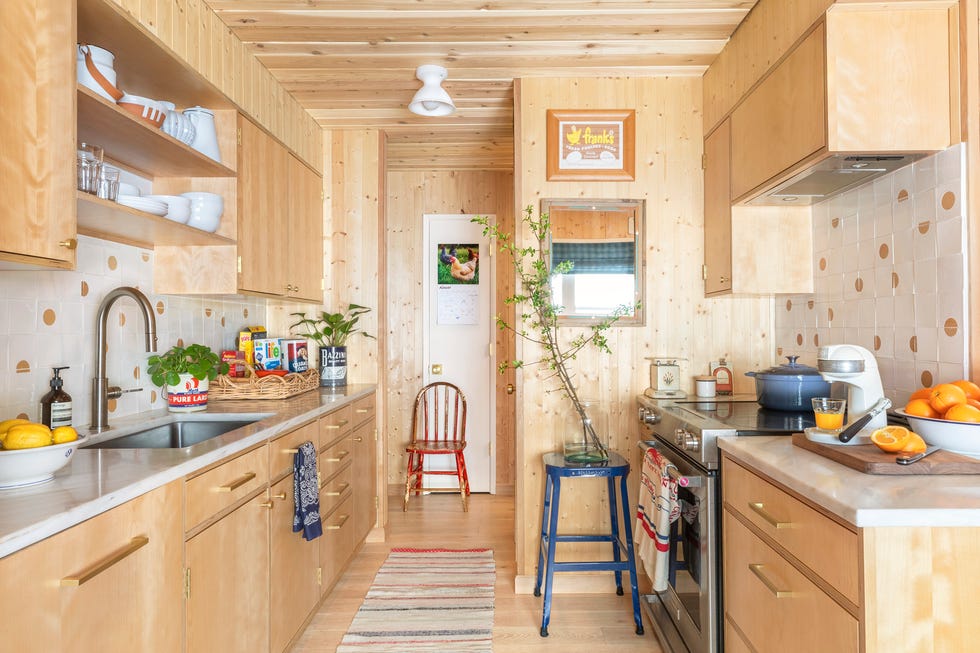 large galley kitchen with woodgrain cabinetry 1970s rancher designed by max humphrey in portland suburb kitchen