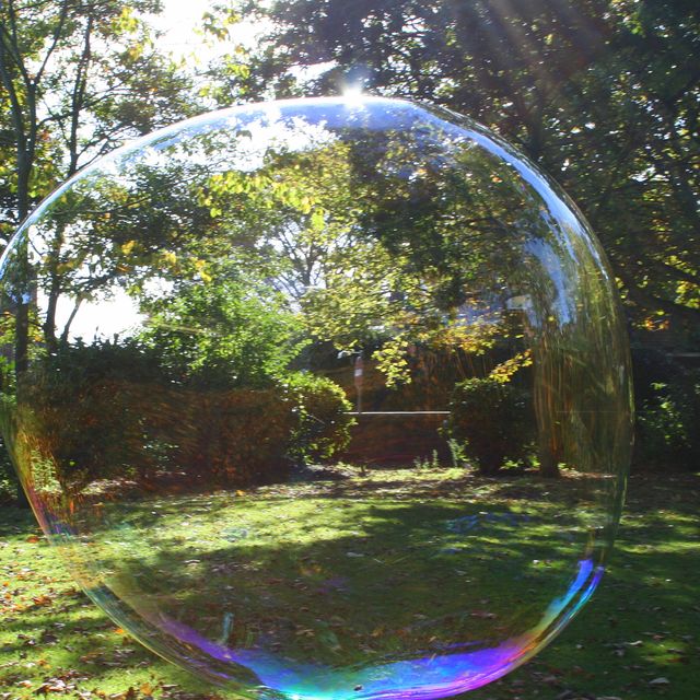 .Large soap bubble in park