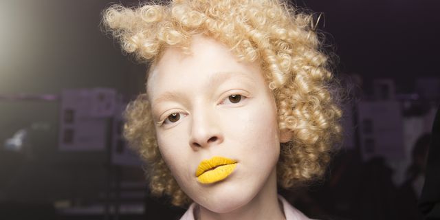 Hair, Face, Lip, Afro, Hairstyle, Jheri curl, Head, Yellow, Beauty, Nose, 