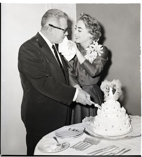 joan crawford and new husband cut cake