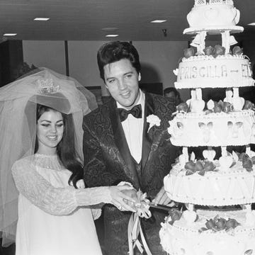 Elvis and Priscilla Presley with Wedding Cake