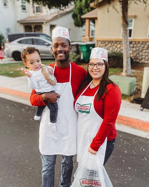 family dressed like krispy kreme employees with baby in doughnut costume