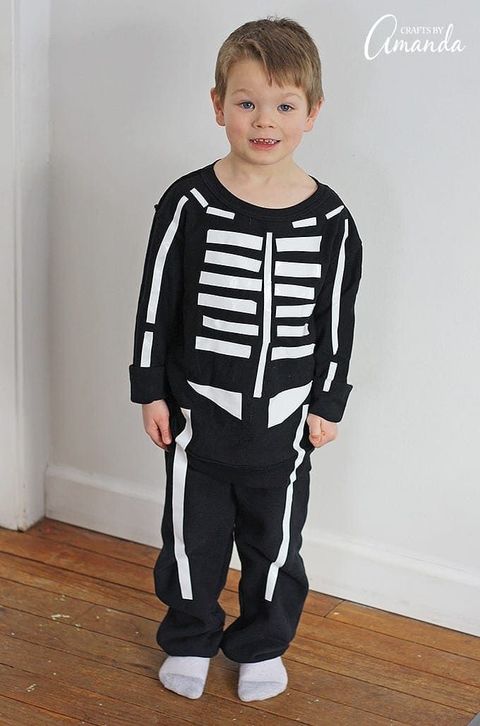 lastvminute kids skeleton halloween costume made from black pants, black long sleeve top, and bones cut from duct tape