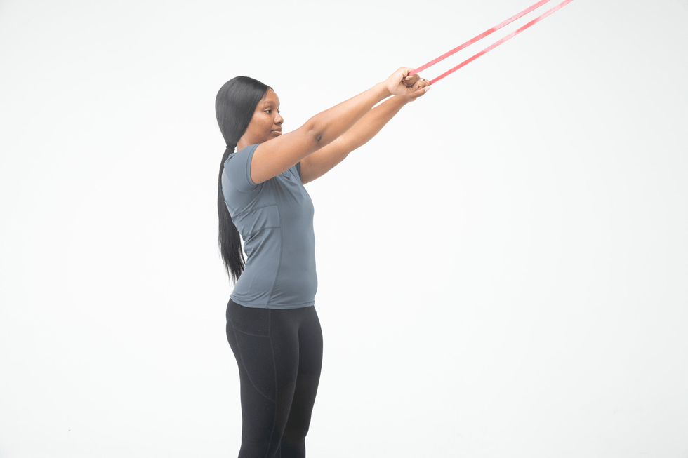 person performing an exercise with resistance bands