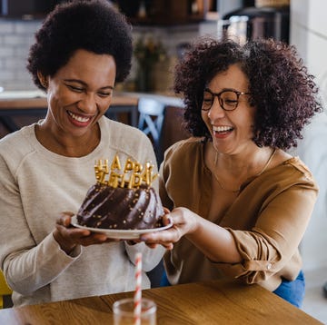 birthday wishes for sister woman is getting ready to blow out birthday candles