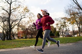 latin friends exercising outdoors