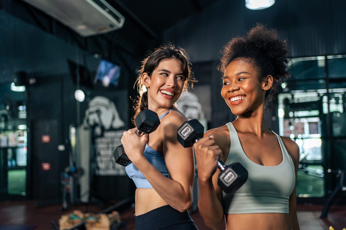 https://hips.hearstapps.com/hmg-prod/images/latino-and-african-sport-woman-exercising-and-build-royalty-free-image-1701355323.jpg?crop=1.00xw:0.752xh;0,0.171xh&resize=1200:*