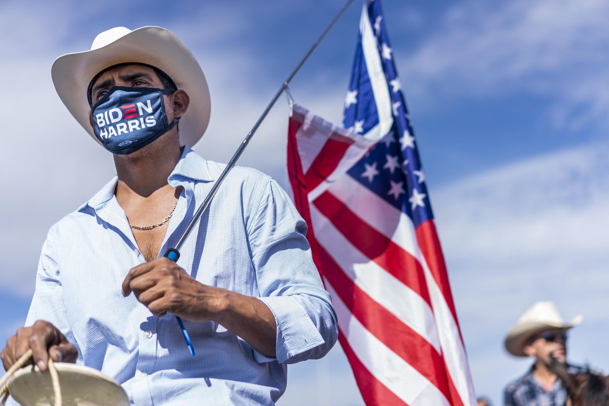 latinx supporters attend a bidenharris nevada hispanic legislative caucus and supporters on horseback rally at the walnut community center's early voting location in las vegas, nevada on saturday, october 24, 2020