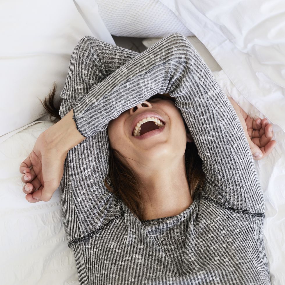 laughing babe in bed