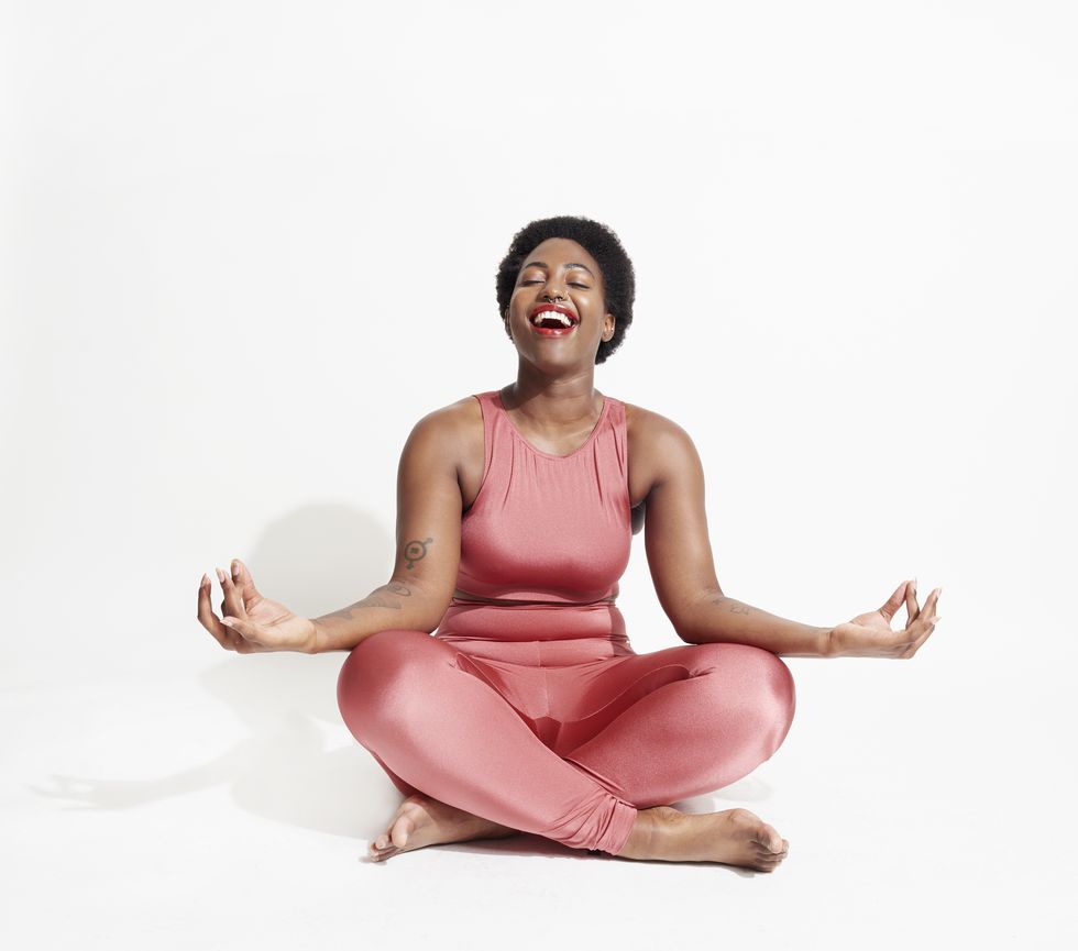 laughing woman in lotus position