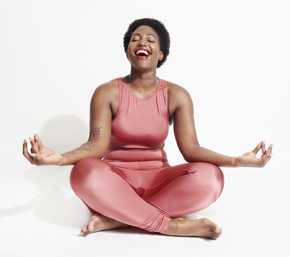 laughing woman in lotus position