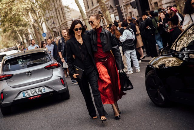 a man and woman walking down the street