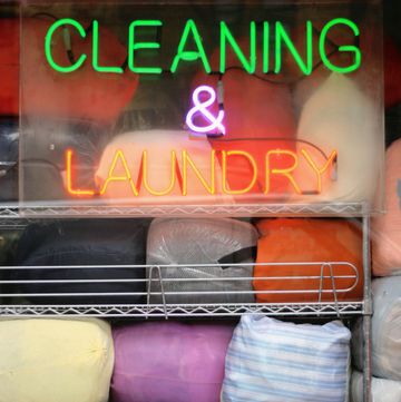 laundromat window dry cleaning and laundry neon sign